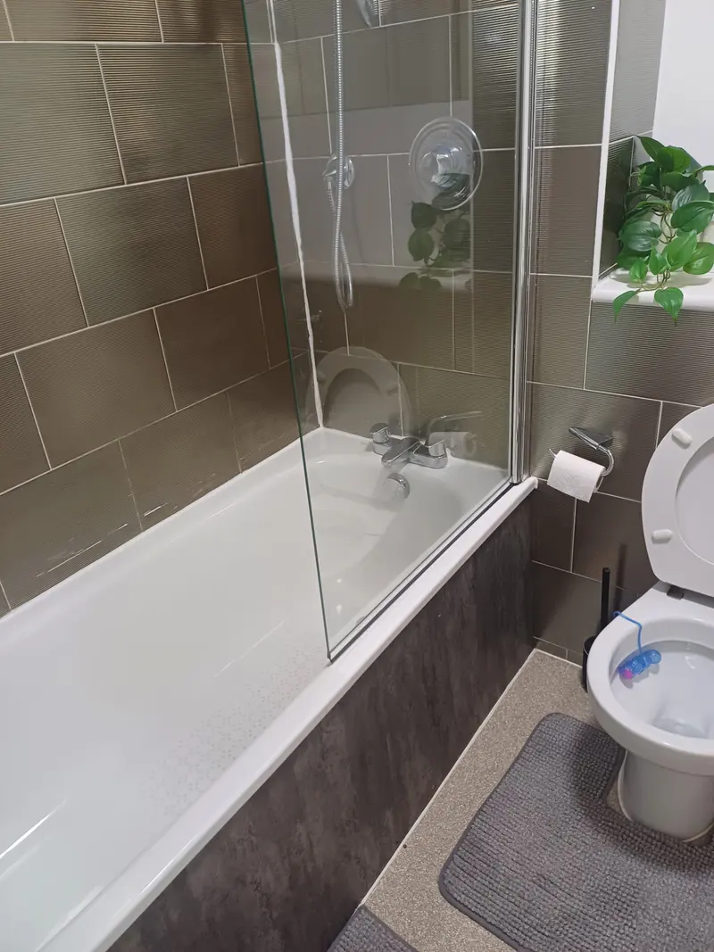 Sparkling bathroom with bath and shower